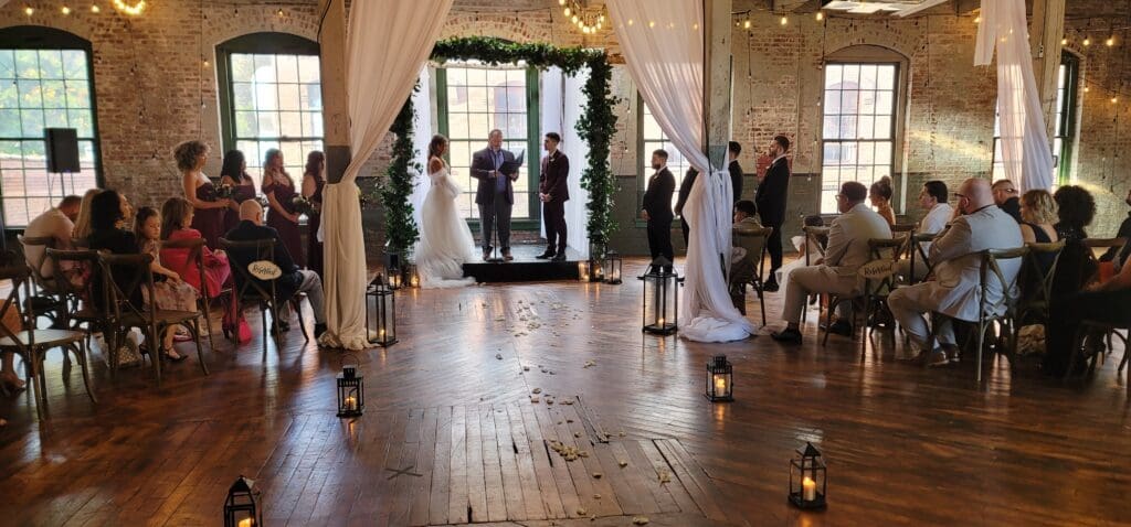 “Wedding ceremony with guests seated at a New Jersey venue.”